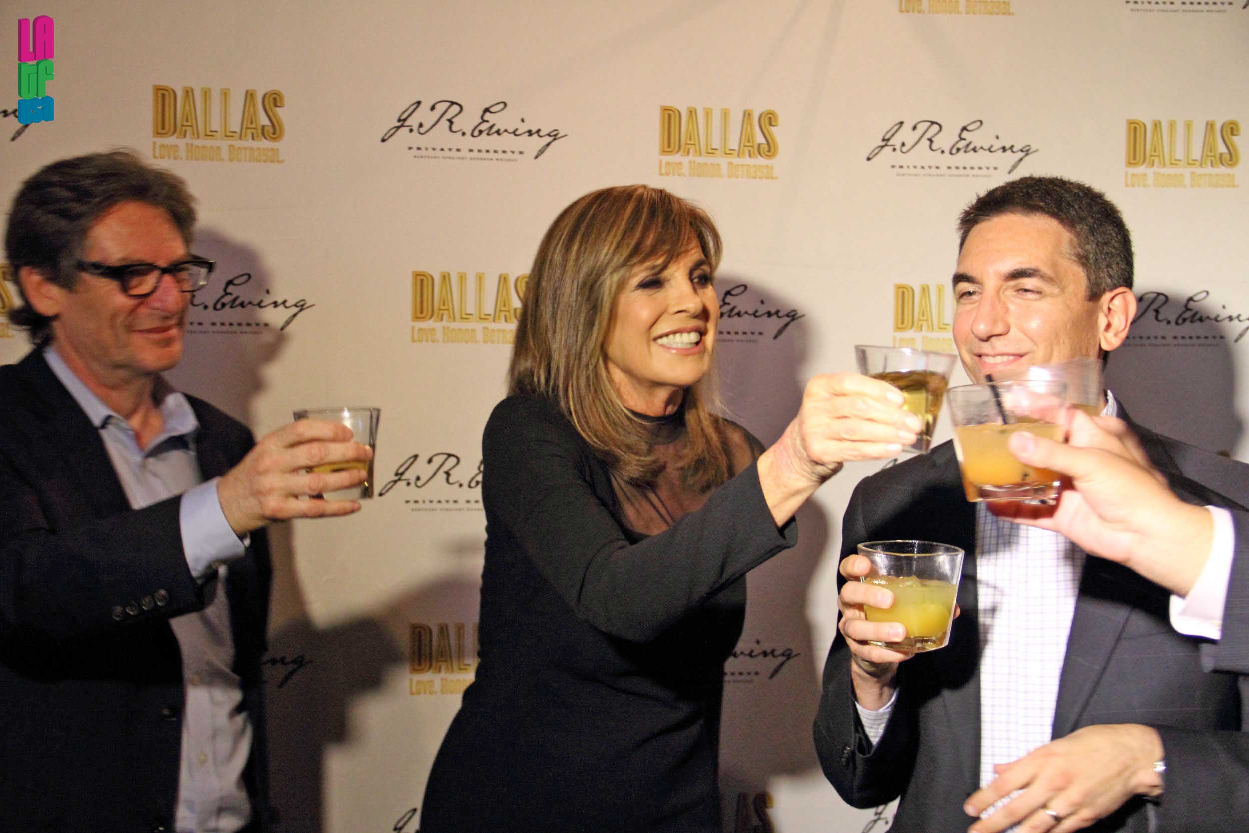 Linda Gray toasts with Andy Harmon & Charles Waldman