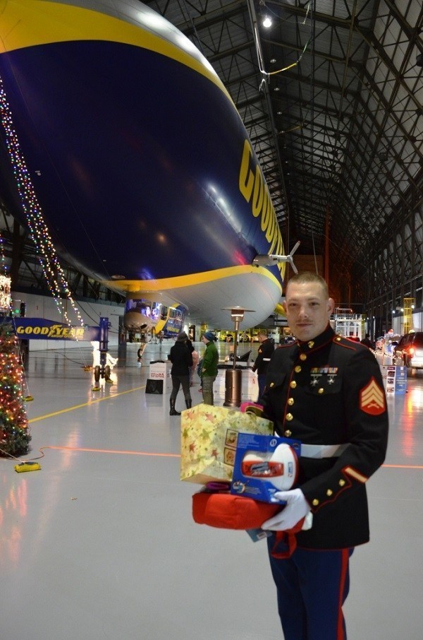 U.S. Marine Sgt. Richard Radtke is all smiles during the 2014 Toys for Tots drive at the Goodyear blimp base in Suffield, Ohio.