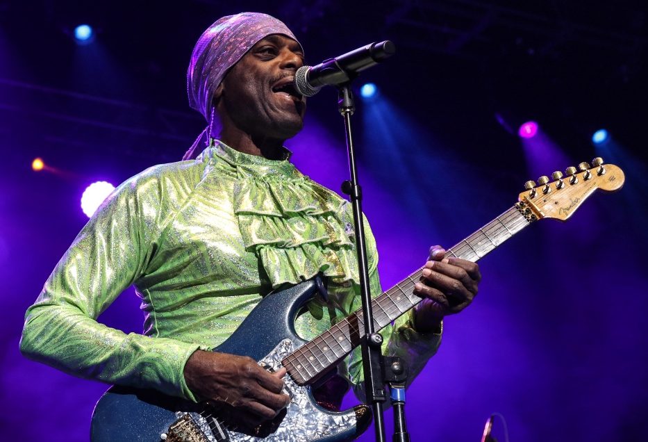 Otis stokes from the band lakeside playing a guitar and wearing a green shirt