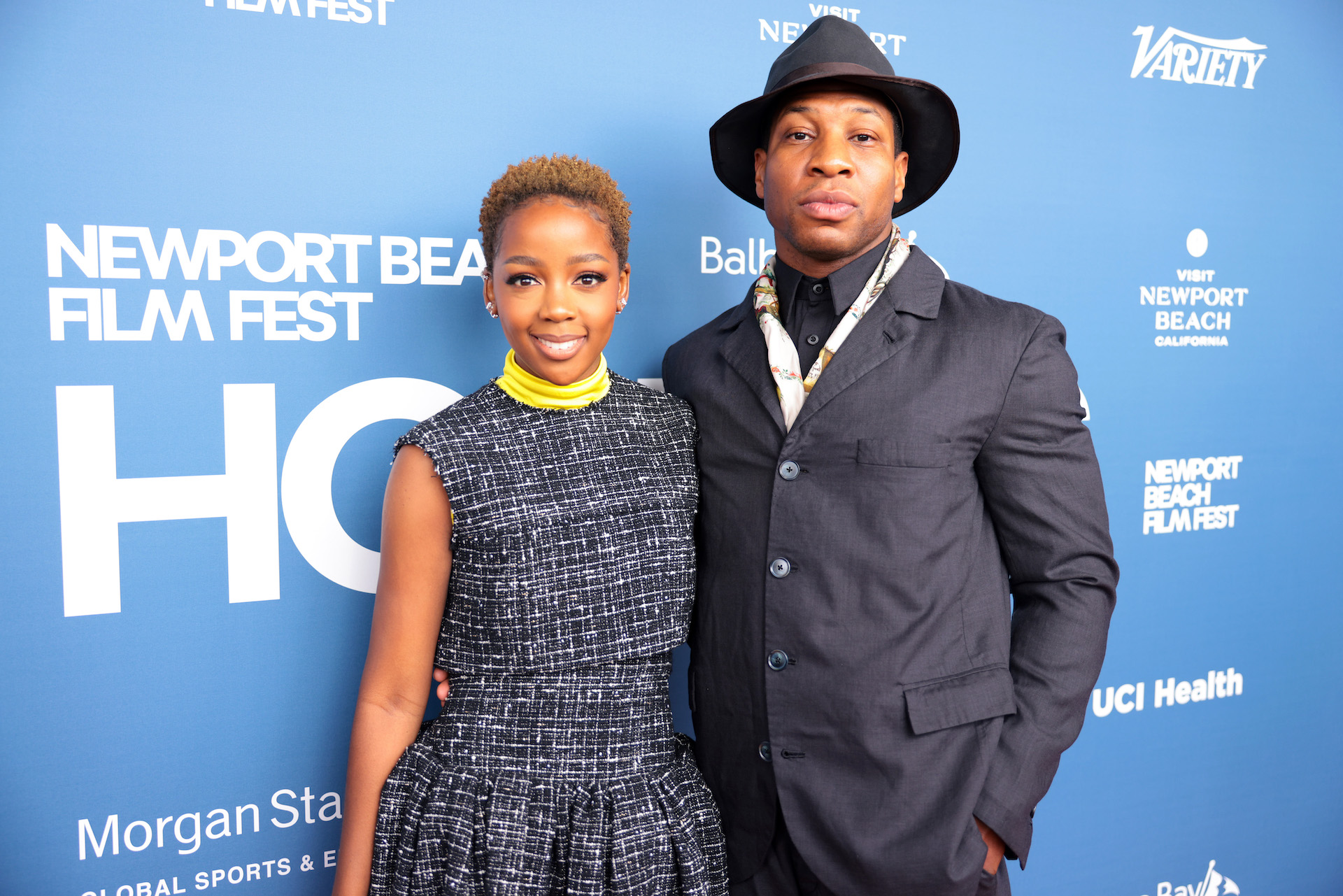 NEWPORT BEACH, CALIFORNIA - OCTOBER 16: (L-R) Thuso Mbedu and Artist of Distinction award honoree Jonathan Majors attend the 2022 Newport Beach Film Festival Honors at The Balboa Bay Club and Resort on October 16, 2022 in Newport Beach, California. (Photo by Tiffany Rose/Getty Images for Newport Beach Film Festival)