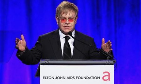 Singer Elton John speaks during a benefit for the Elton John AIDS Foundation in New York