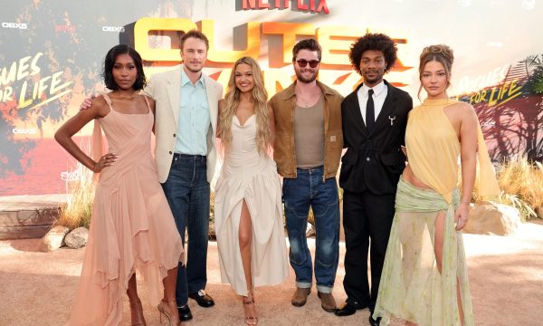 LOS ANGELES, CALIFORNIA - AUGUST 15: (EDITORS NOTE: This image has been retouched.) (L-R) Shannon Burke, Carlacia Grant, Jinny Howe, Head of UCAN Scripted Series, Netflix, Drew Starkey, Ted Sarandos, Co-CEO, Netflix, Madison Bailey, Jonas Pate, Chase Stokes, Josh Pate, Jonathan Daviss and Madelyn Cline attend Pogues For Life: A Fan Farewell with the Cast of Outer Banks at The Ford on August 15, 2026 in Los Angeles, California.  (Photo by Emma McIntyre/Getty Images for Netflix)