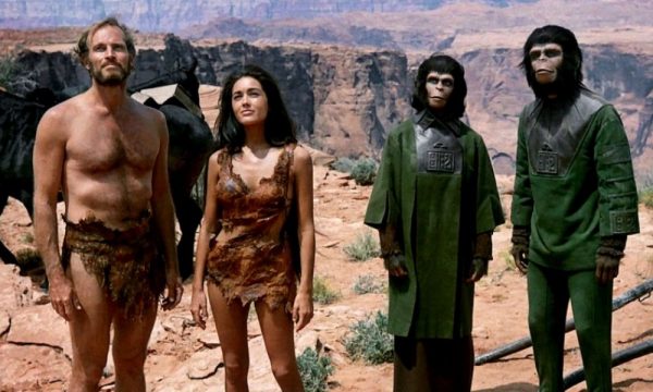 planet-of-the-apes-1968-001-group-against-background-with-rocks